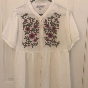 White button-up embroidered shirt.